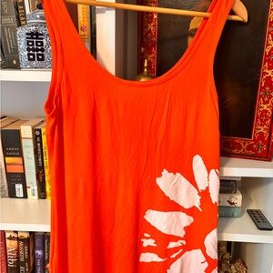 Asos 
Orange Sleeveless Top with White Floral Design
Stretch, hugs curves